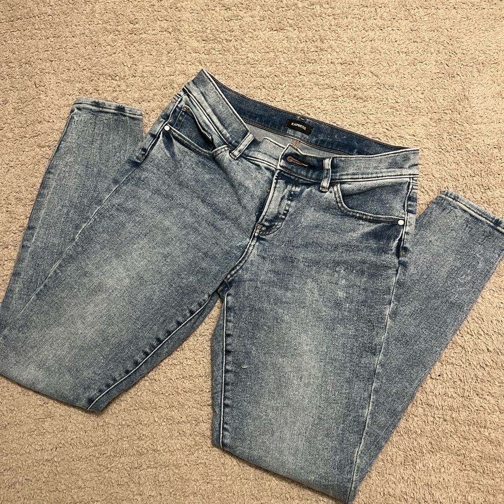 Express Blue Skinny Jeans with Distressing and Vintage Appeal
